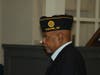 A member of American Legion Post 10 takes part in the ceremony, representing continued service and remembrance within the Newark veteran community.