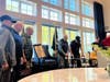Veterans Eugene Missmer, James Cook, Lynn Webster, Richard Libera, and Ed Crispin gather to reflect and remember during the National POW/MIA Recognition Day tribute.