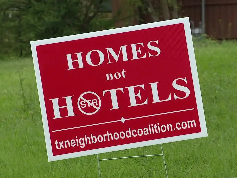 Homes not Hotels sign