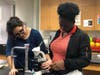 Senior Sooliat gets help with her JST project from Roycemore alumna, Alanis, while studying the biological and social effects of Ebola across the globe.