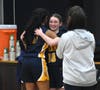 Seniors Sidney Rogers and Anjali Nimmagada embrace late in the fourth quarter after coming off the floor the final time.