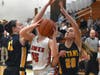 Glenbrook South's Amanda Karavites (left) and Madison Wessel (right) attempt to block the shot of Maine South's Julia Hamel.