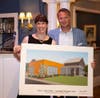 President Dr. Kimberly Shaunesey & Board Chair Greg Fenn with a rendering of a new Life Skills Vocational Training Ctr.