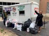 Participants in STEAMfest donated clothing, footwear and other items for recycling. Left to right: Vanesa Estime and HCC Academic Dean Robin Avant. 