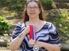 HCC’s Five-Star PTK Chapter President, Rebecca DelValle stands with her Coca-Cola Scholars and All-Connecticut Academic Team medals.