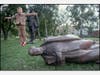 Russian Child jumps off toppled statue of Stalin, 1991