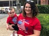 Homes for the Brave Chief Clinical Officer Stephanie Lynam holds 8-month-old Willow, the youngest Step OUT for the Brave event participant.