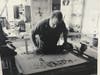 James Reed, subject of the film “A Story In Stone,” at work with stone lithography in his Milestone Graphics studio in Bridgeport, CT.