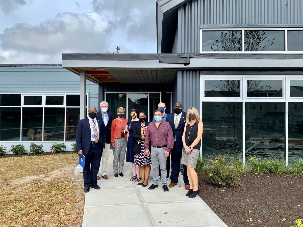 Kim Shaunesey, Ph.D., President & CEO of Boys & Girls Village, (center) stands with Gateway Community College CEO Dr. William Brown (left), Housatonic Community College CEO Dr. Dwayne Smith (right) and members of the three organizations.
