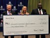 Peter J. Werth Jr. (left) stands with HCC Foundation Executive Director Kristy Jelenik, and HCC CEO Dr. Dwayne Smith.