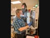 AMTC graduate Sergey Shchelkunov demonstrates a HAAS Mini Mill CNC machine. 