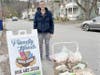 Torrington resident Richard Hubbard stands with his donation of vegan Thanksgiving meals to Friendly Hands Food Bank.
