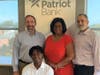 HCC Student Koffi Gnamien (seated), standing (l-r) Rob Russell, CEO and Bank President, Judith Corprew, EVP and Chief Risk, Compliance and CRA, and Steven Grunblatt, EVP and CIO.