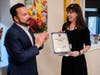 Bridgeport Mayor Joseph Ganim presents Kim Shaunesey, Ph.D., President & CEO of Boys & Girls Village with a certificate of congratulations for opening the new Quality Parenting Center.