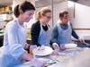 The O&G team serving a meal at the Pacific House Shelter in Stamford, CT, Left to right: Christina Oneglia Rossi, Vice President of Business Development, Eliza Baron, Communications and Marketing Manager, and Brad Oneglia, Vice President.