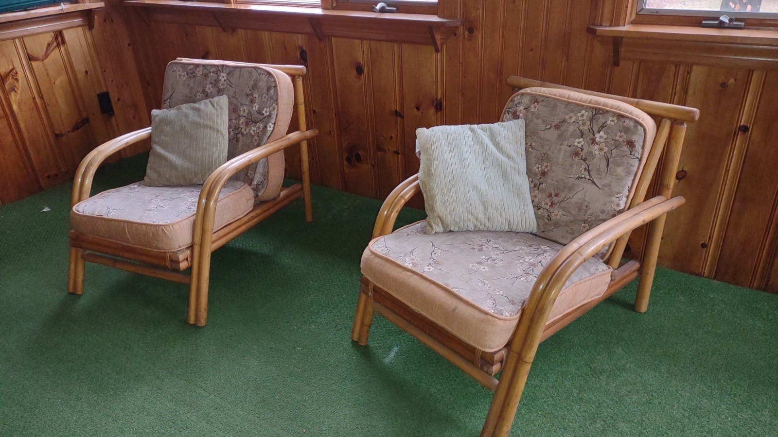 Beds, dresser with mirror, love seat couch, bamboo framed porch