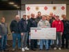 Fairfield Fire Fighters Charitable Foundation members celebrate a record-breaking fundraising total for the Tommy Fund for Childhood Cancer.  