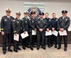 Firefighters surround their brother who they successfully resuscitated in September. 