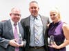 (L-R) Tyler Smith of Kidder Mathews, Jeff Swanson, Executive Director of Administration at One Step Beyond, and Anna Sepic of LevRose. Smith and Sepic received the annual HUG Award from One Step Beyond for advocacy efforts.