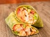 The Buffalo Ranch Wrap with chicken breast, pepper jack cheese, hot sauce, ranch, tomato, red onion, and lettuce.