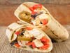 The Chicken Fajita Wrap features chicken breast, pepper jack cheese, Baja sauce, bell peppers, red onion, jalapeños, and tortilla strips.