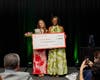Addison White poses with her MotivEight scholarship alongside Shonette Paisley, senior enterprise trainer at Fiserv and MotivEight member