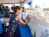 Linda Carter, Holy Cross Health Board Member, signs the ceremonial steel plate that will be incorporated into the future Holy Cross Health Center & Emergency Care – Fort Lauderdale at Sunrise.