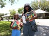 Little and her mom bringing home school supplies