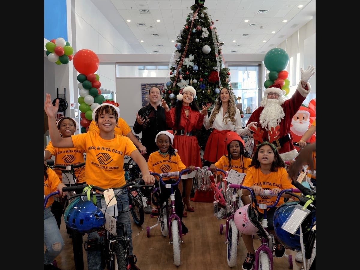 Caption: Members of the Boys & Girls Clubs of Broward County receive bicycles from Rick Case Bikes for Kids
