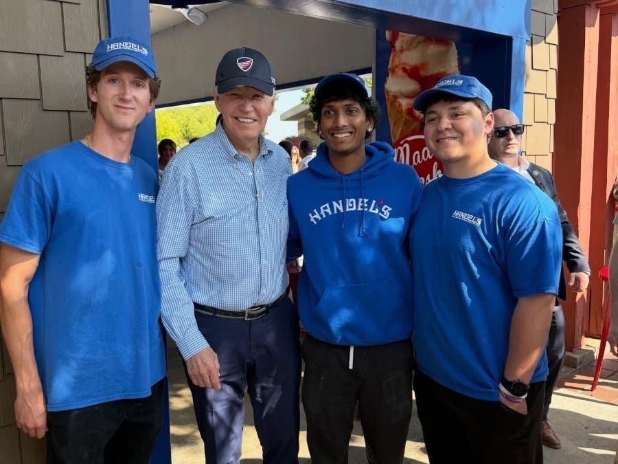 Former President Joe Biden poses for a photo with employees at Handel's Homemade Ice Cream in La Cañada Flintridge.