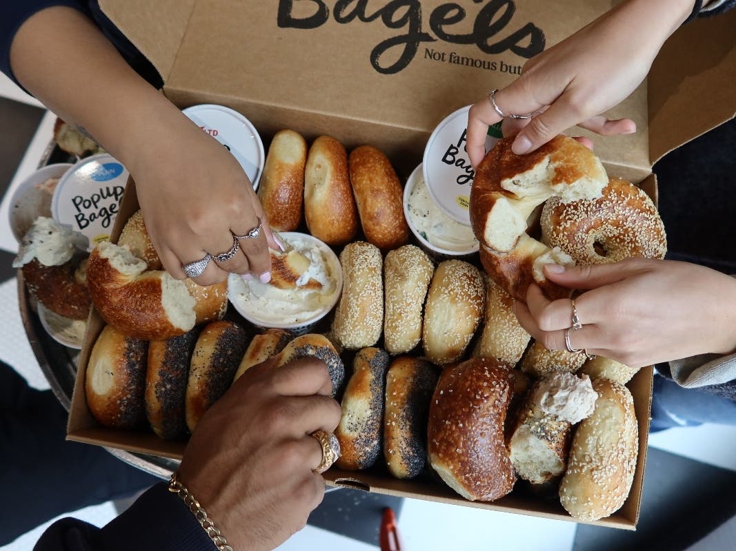 PopUp Bagels is known for serving whole bagels fresh from the oven. Customers are encouraged to eat them using the brand's “Grip, Rip and Dip” approach, tearing the bagels apart and dipping them into cream cheese.