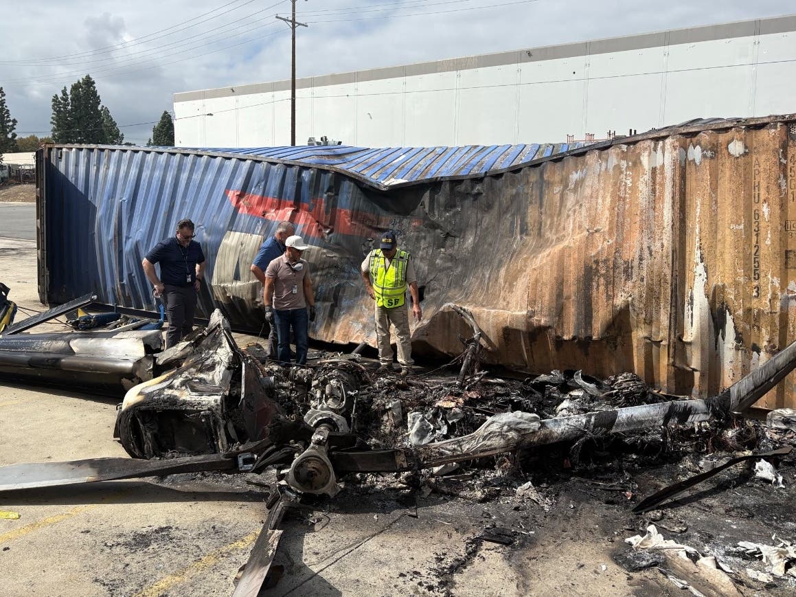 NTSB investigator-in-charge Fabian Salazar begins the on-scene examination of the Eurocopter AS 350 B2 helicopter that crashed Tuesday night in Chatsworth.
