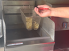 French fries cooking in oil inside one of Vazzy's Canteen trucks. Used cooking oil from this food truck, and all of Vazzano's other restaurants, is recycled into biodiesel. 