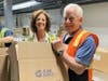 Assemblymember Charles Lavine joins Island Harvest CEO Randi Shubin Dresner in Melville to help package boxes for the Commodity Supplemental Food Program (CSFP).