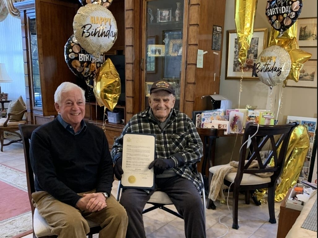 Assemblymember Charles Lavine presents a citation to World War II veteran Eli Levine in Melville on Friday, February 16, 2024