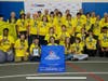 The Buzz Robotics team poses with their winning alliance banner and trophy.