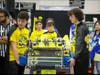 The Buzz Robotics Drive  Team prepared to load the robot onto the field.