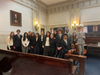 Mock Trial students in a courtroom after their competition on Monday night. 