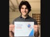 Hudson School junior Alexander De Belen – scoring #10 in the country – poses with his National French Exam certificate. 