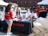 Alejandra Afanador (center, sitting) and other RU Voting Ambassadors operate a registration table outside of the Center for Latino Arts and Culture on Sept. 22.