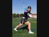 Allison Gandlin, who attends the Rutgers School of Engineering and the Honors College, does the Heisman pose on a sports field at Busch campus.