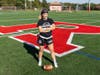 Allison Gandlin, a sophomore at Rutgers University-New Brunswick, stands on a sports field on Busch campus.