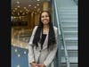 Ashley Caldwell, who attends the Edward J. Bloustein School of Planning and Public Policy, poses next to a flight of stairs in New Brunswick High School.