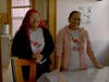 In the documentary "Promotora," Kareli Barragan (left), the daughter of Martha Barragan, stands next to her mother (right) in a kitchen. Both are promotoras.