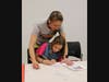 Hamilton resident Julia Harrison (left) helps her daughter Annika with a printmaking project in the Zimmerli Art Museum.