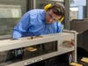 Rutgers-New Brunswick senior Doug Doyle operates a miniature wind tunnel in a School of Engineering lab on Busch campus.