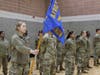 Eden Han, a second-year cadet, acts as guidon flag bearer for the upperclassmen formation, who stand at parade rest before the start of Leadership Laboratory in January at the Sonny Werblin Recreation Center.