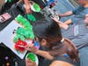 Students participating in the Aresty Research Center and the Innovation, Design and Entrepreneurship Academy (IDEA) summer programs decorate cupcakes as part of a June contest in the Hatchery Innovation Studio within the Archibald S. Alexander Library.