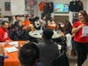 Rutgers students involved in The Conversation Tree program and members of nonprofit group New Labor take part in a language practice activity in December 2022 at New Labor's New Brunswick, N.J., office.