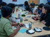 Assistant professor Sue Huang (left) talks to students participating in a botanical workshop held in the Zimmerli Art Museum in early November.